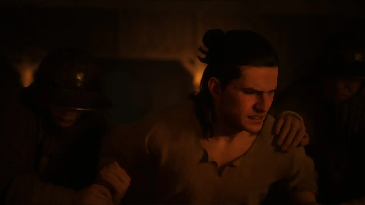 Coen being tended indoors by lamplight