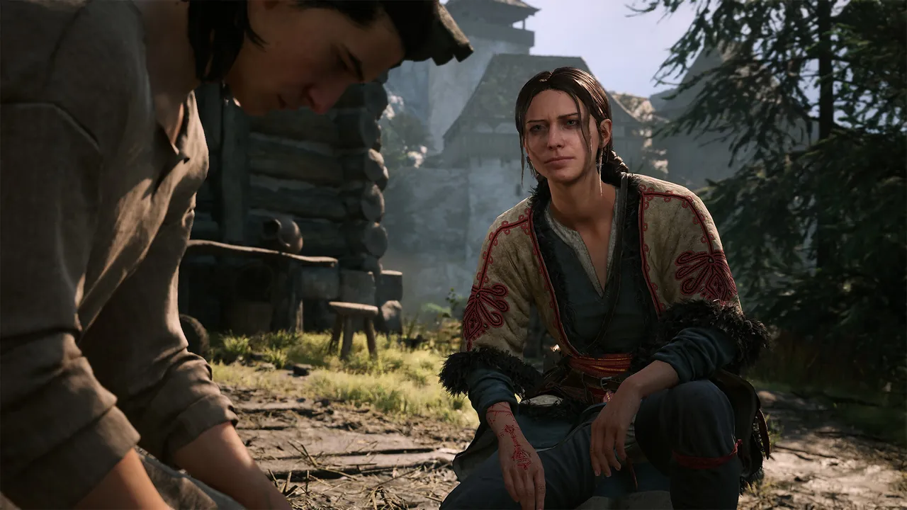 Coen sitting and talking with a Sanzhani woman outside a village