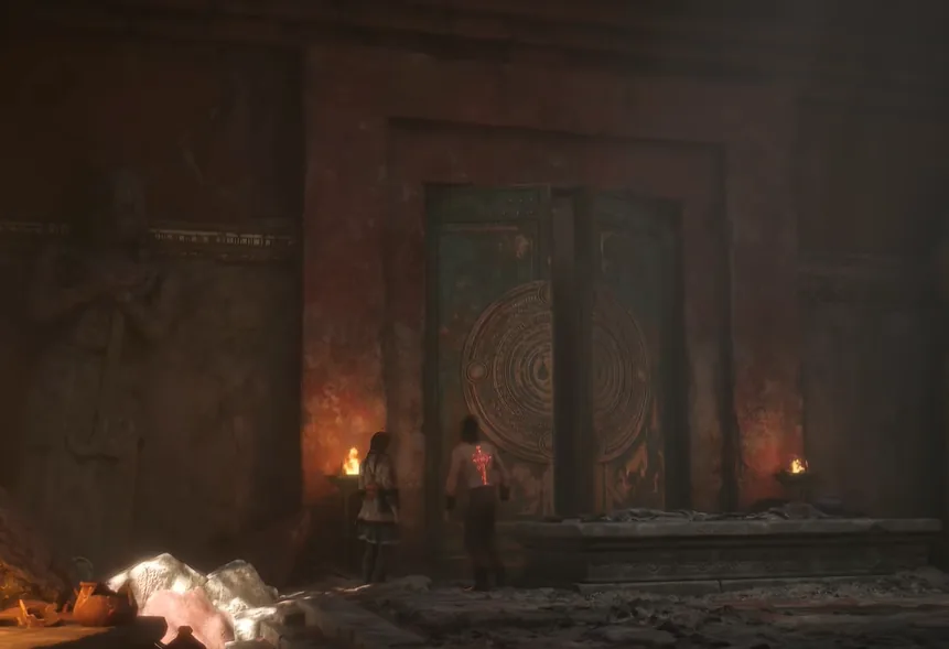 The torchlit ancient door at the ruins