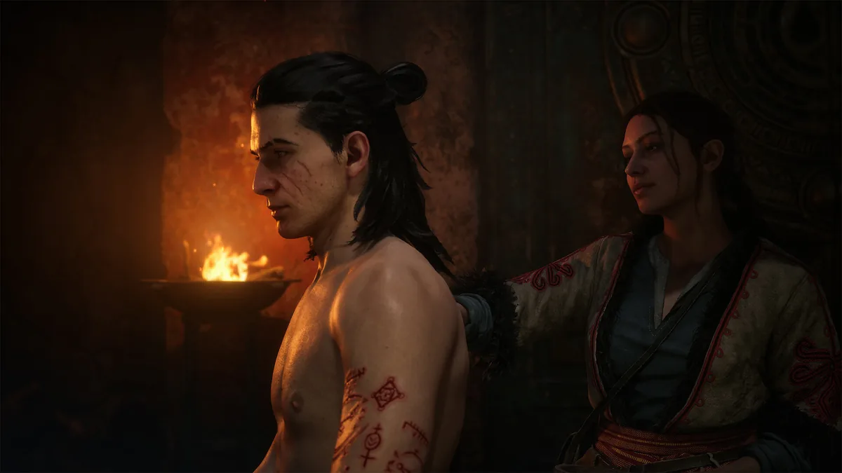 Coen and Anca reading by the hearth in The Blood of Dawnwalker